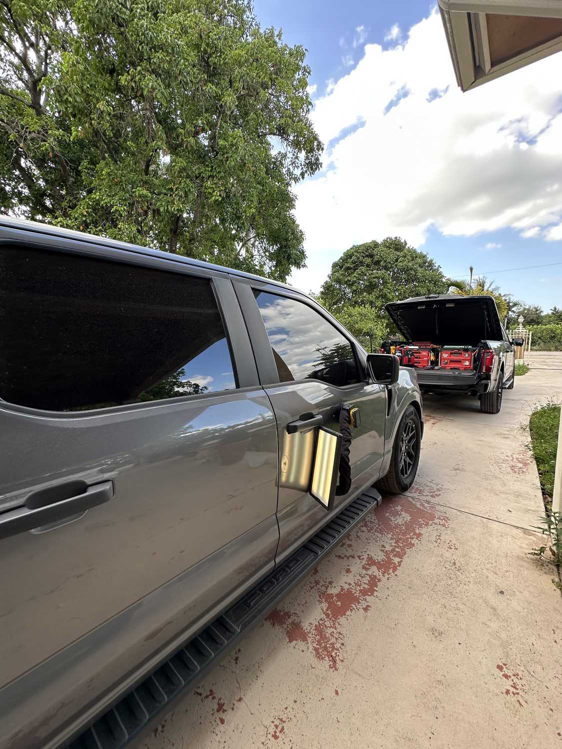 Mobile paintless dent repair on a silver vehicle, Miami
