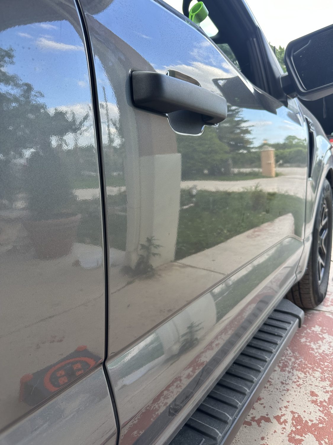 Panel restored after paintless dent repair, factory paint intact, Miami