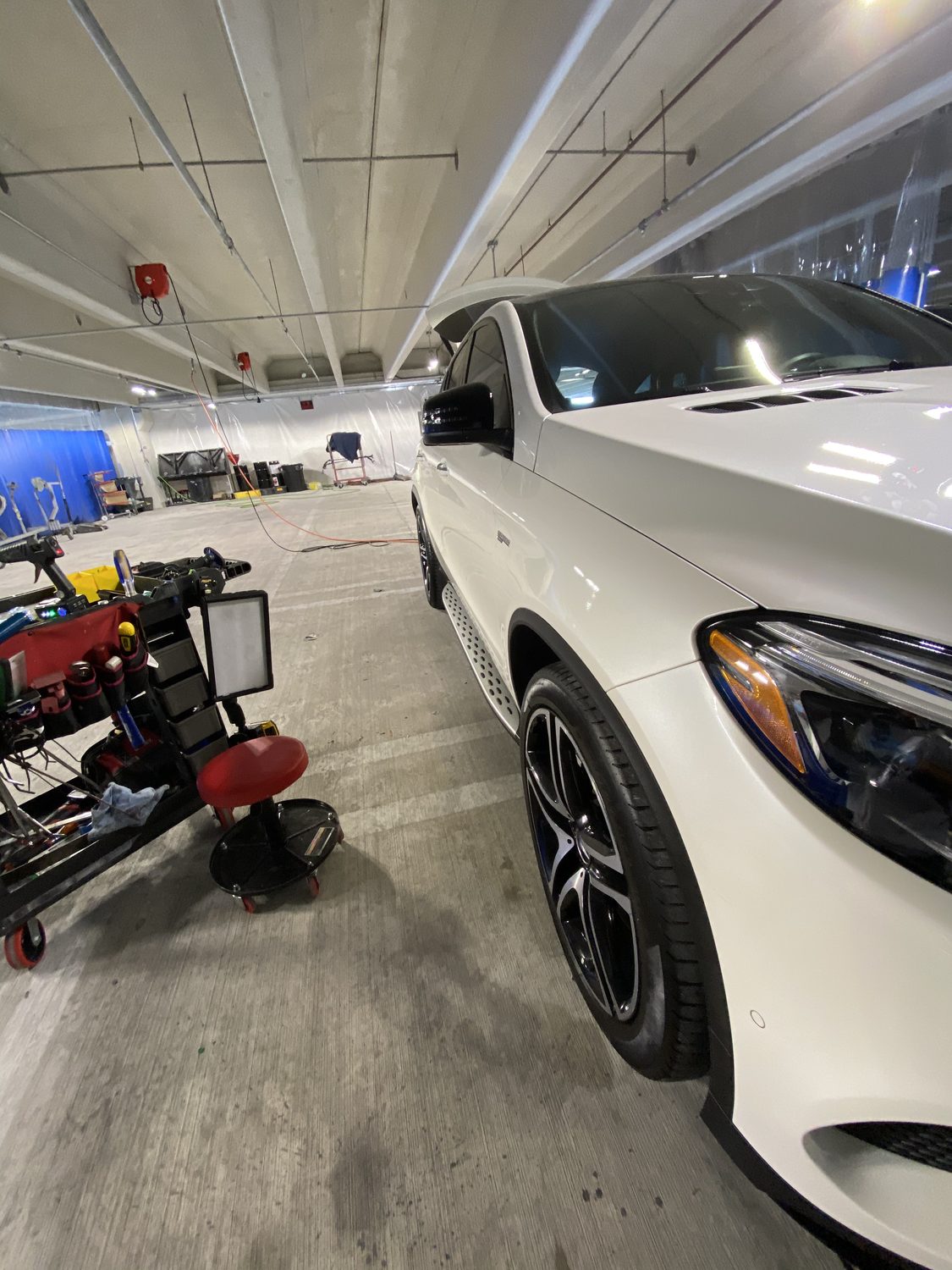 White Mercedes coupe getting paintless dent repair, Miami