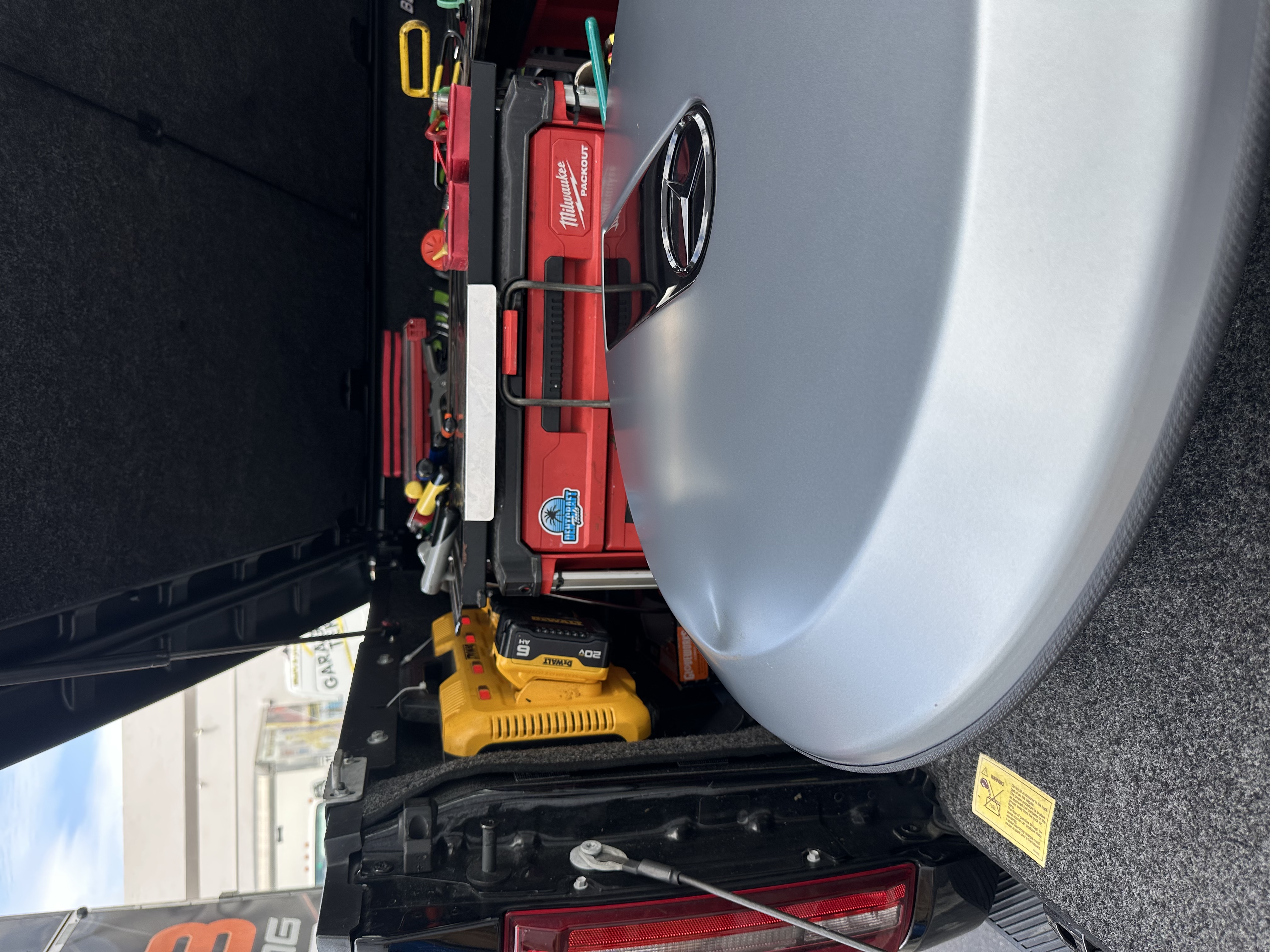 Mobile paintless dent repair setup on a silver Mercedes, Miami