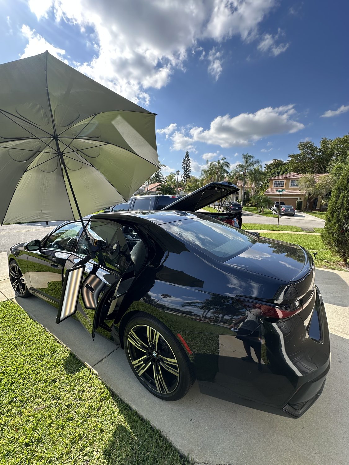 Mobile paintless dent repair at a customer's driveway, Miami