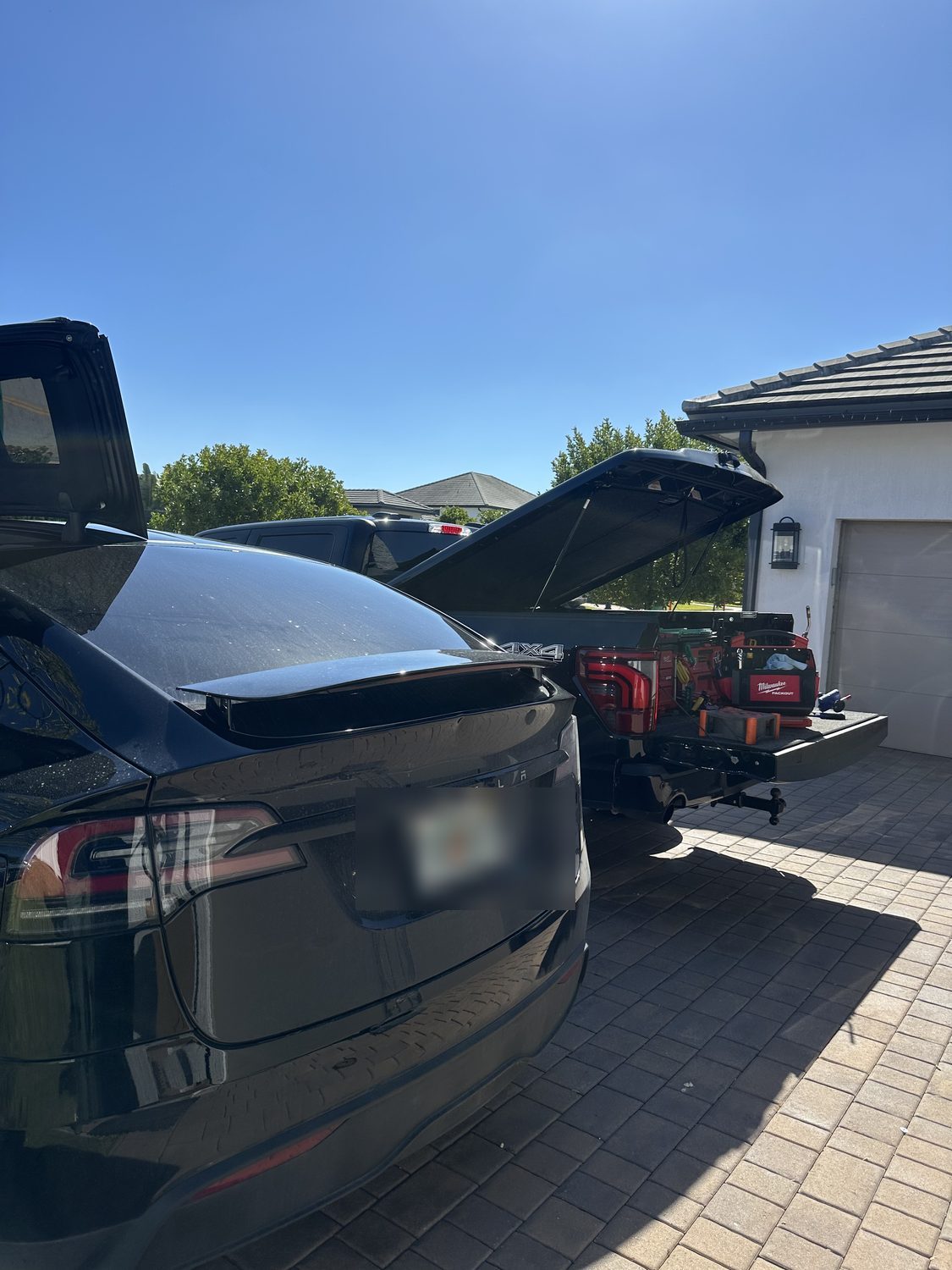Mobile paintless dent repair on an SUV, Miami